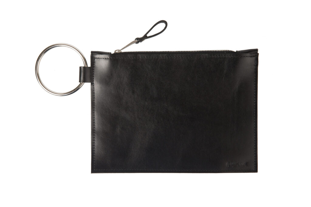 Black Nina leather clutch with a silver ring handle on a white background.